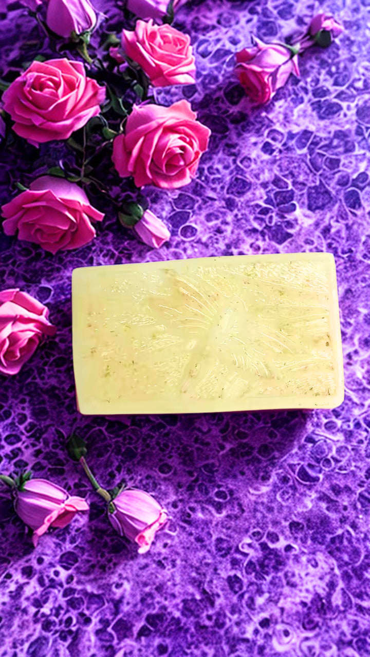 Moonflower bar of soap on a purple textured surface with pink roses.