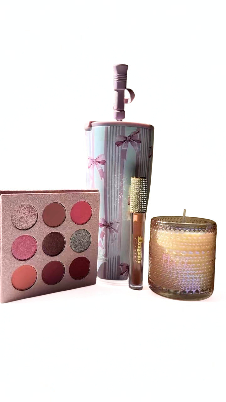 The princess collection includes eyeshadow palette, lipgloss , and candle and tumbler on a white background