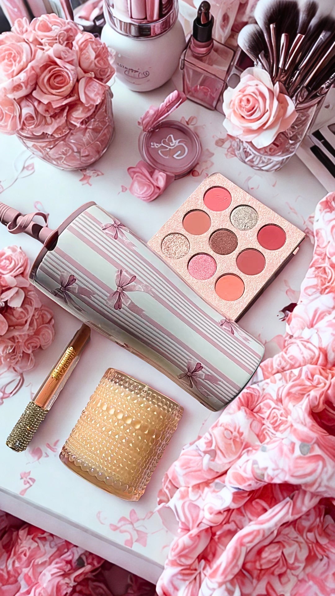 Princess collection includes Makeup products including a eye shadow palette, lip gloss, candle, and tumbler on a pink floral background