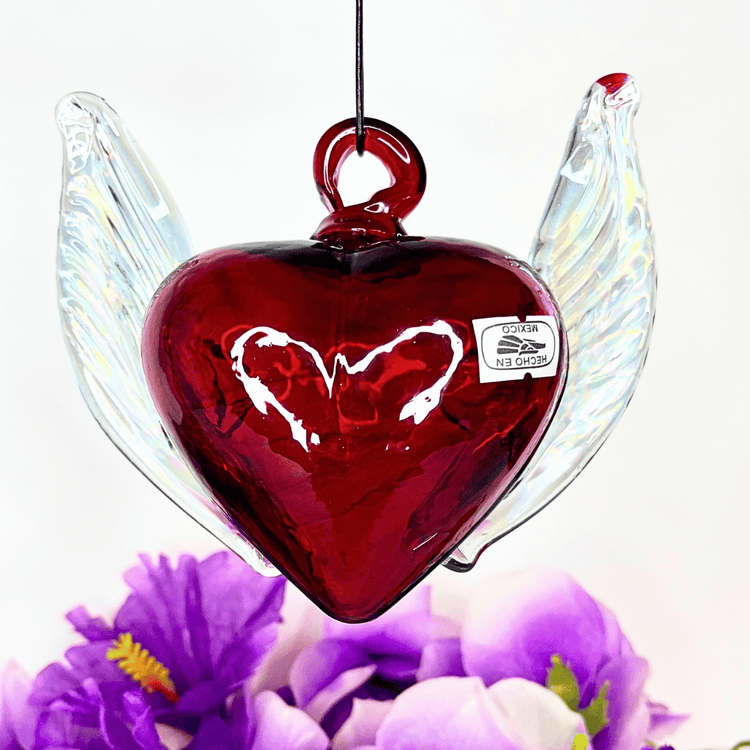 mexican glass heart, handcrafted mexican gifts, glass winged heart art, artisan glass heart mexico, handblown glass gifts, mexican folk art glass, unique gifts from mexico, glass heart ornament, mexican artisan crafts, traditional mexican handcrafts, symbolic heart decorations, gift ideas mexican art, glass heart sculpture, artistic glass heart designs, cultural gift ideas mexico