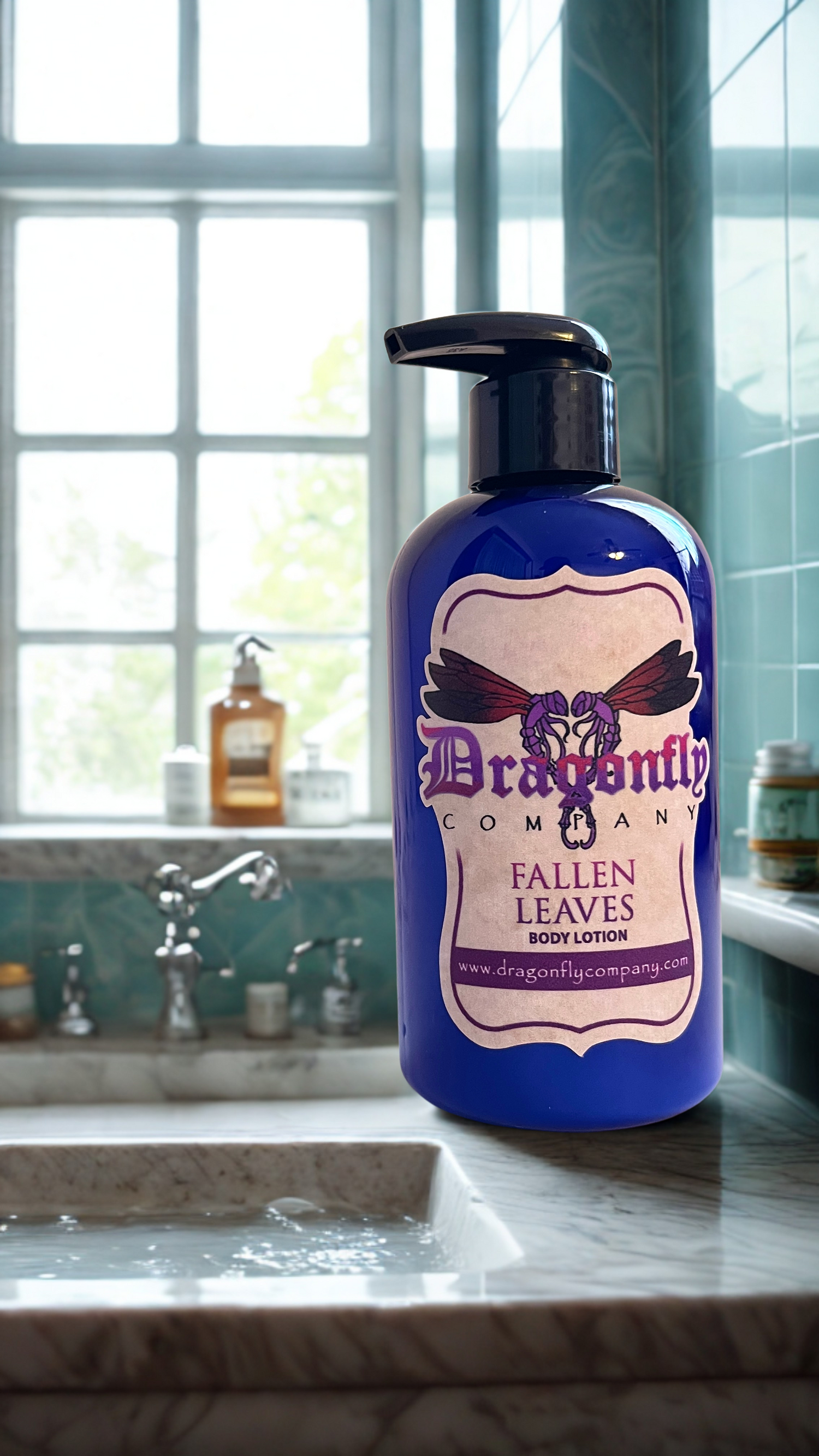 Blue bottle of 'Dragonfly' Roman Fallen Leaves body lotion on a bathroom counter.