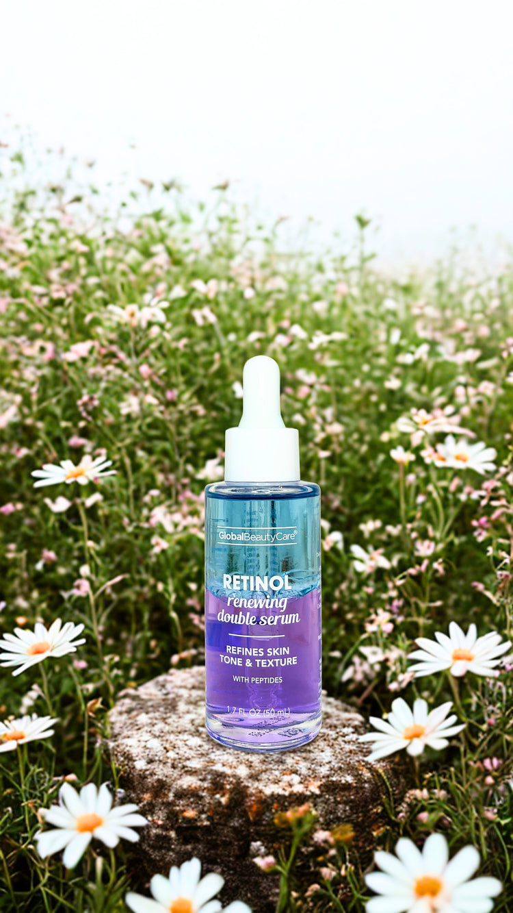 Limited Edition Retinol serum bottle on a rock with flowers in the background