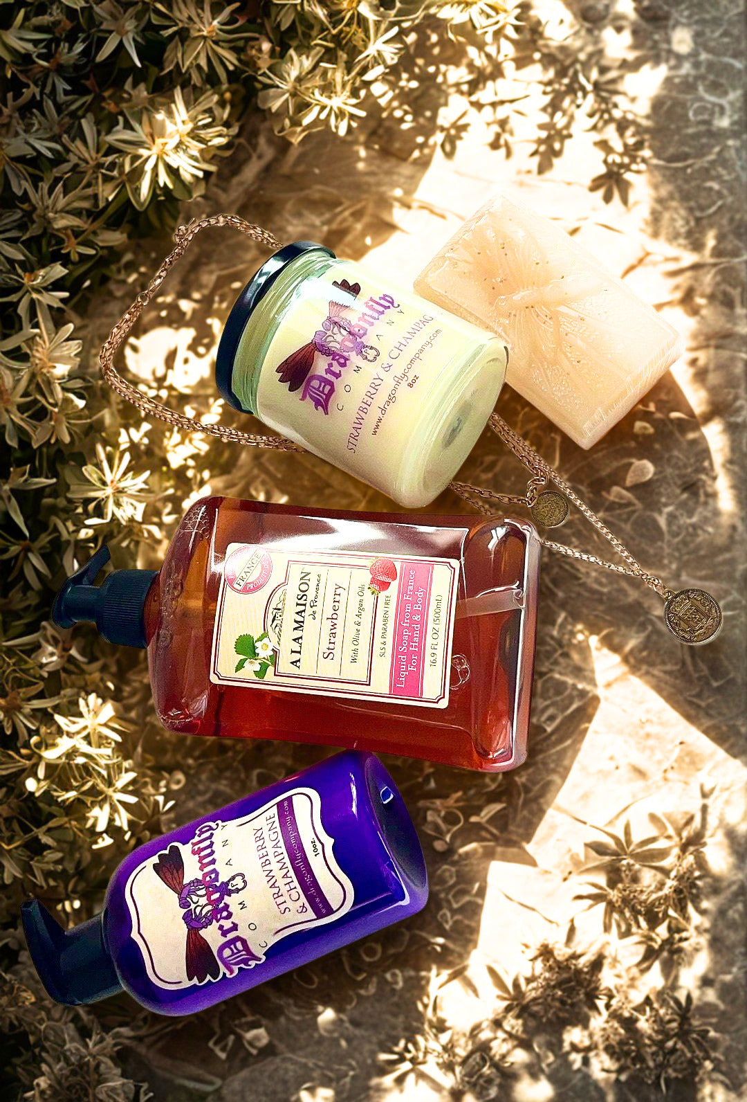 Assorted skincare products including bottles and a jar on a textured surface with plants.