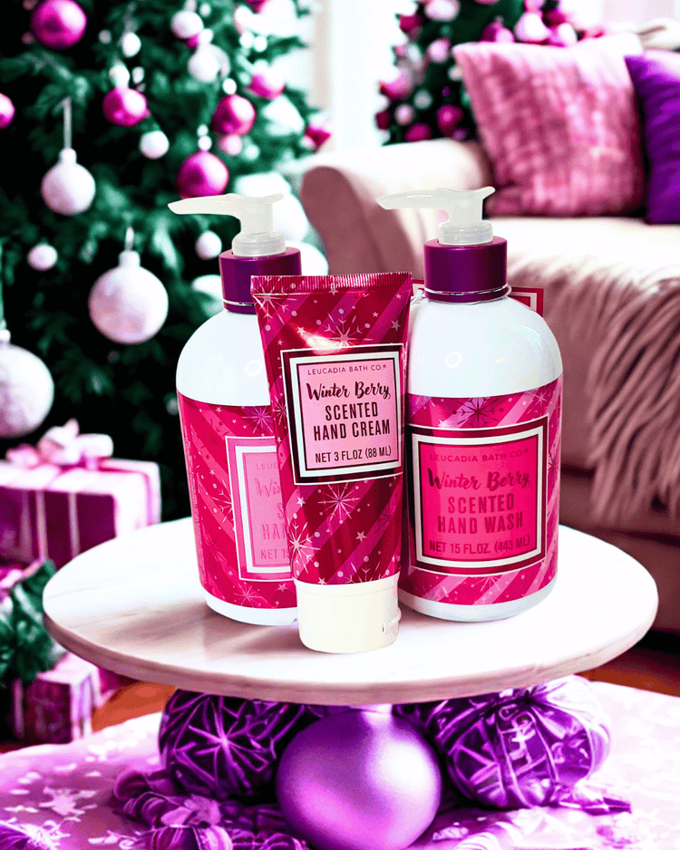 Hand wash and hand cream set on a stand with Christmas decorations in the background
