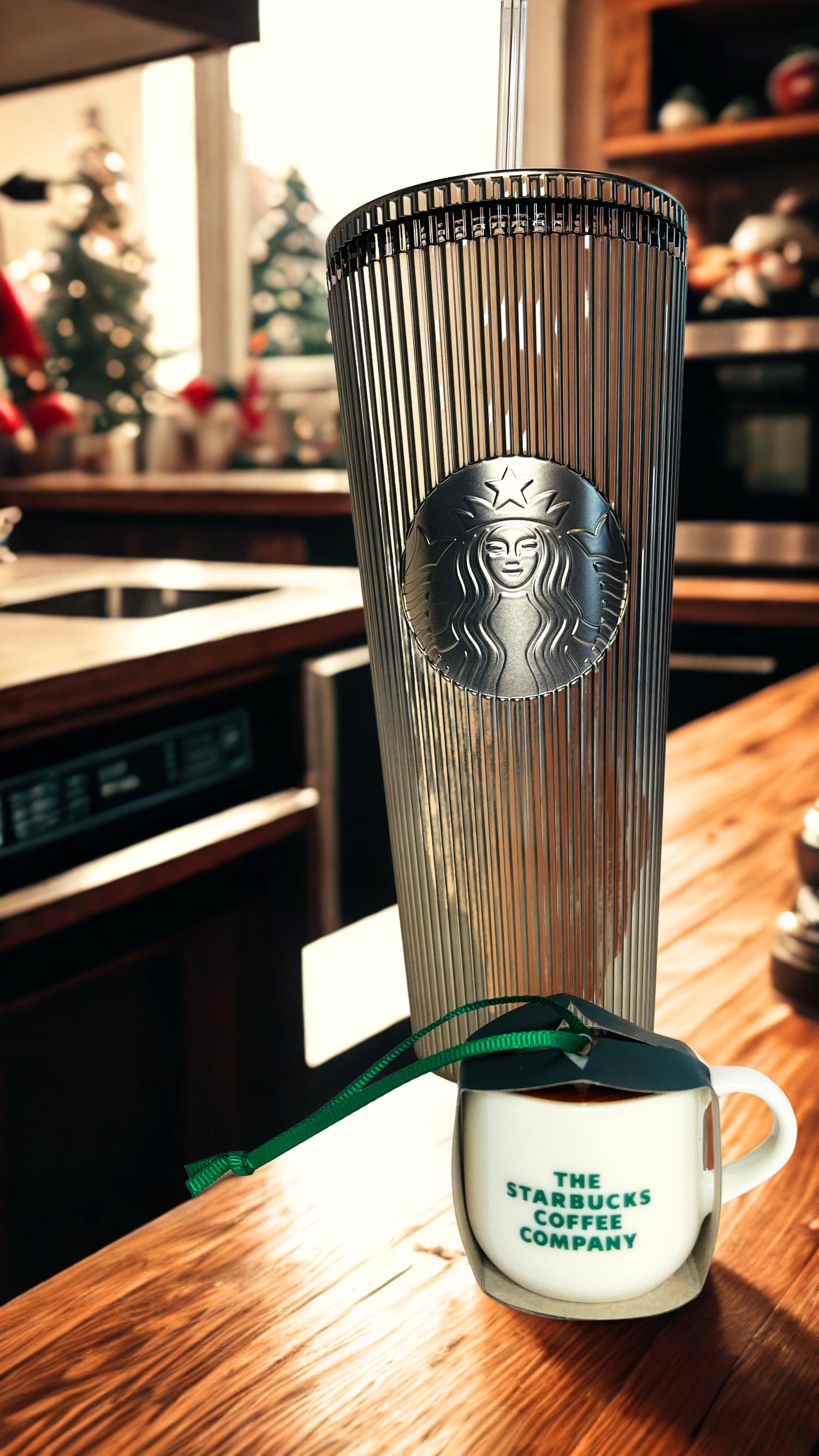 Starbucks tumbler and ornament  on a kitchen counter