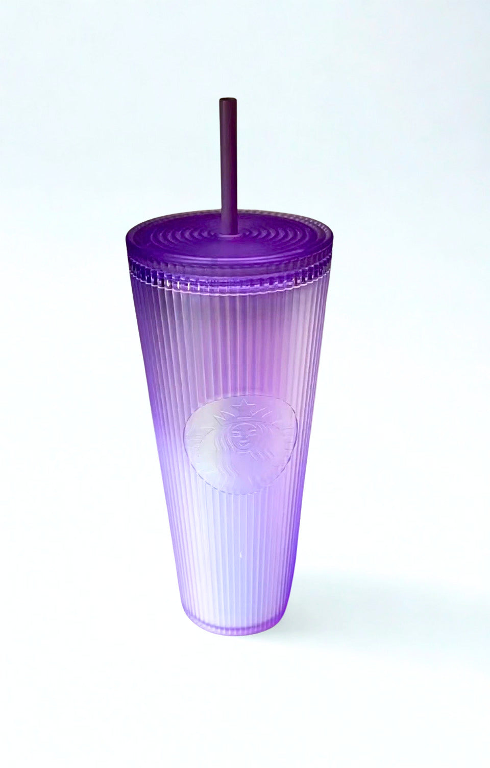 Lavender Starbucks tumbler with a straw on a white background