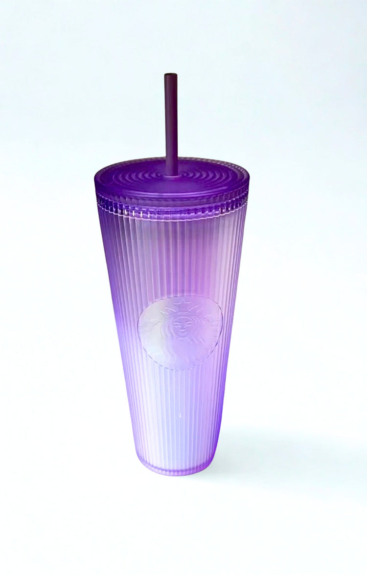 Lavender Starbucks tumbler with a straw on a white background